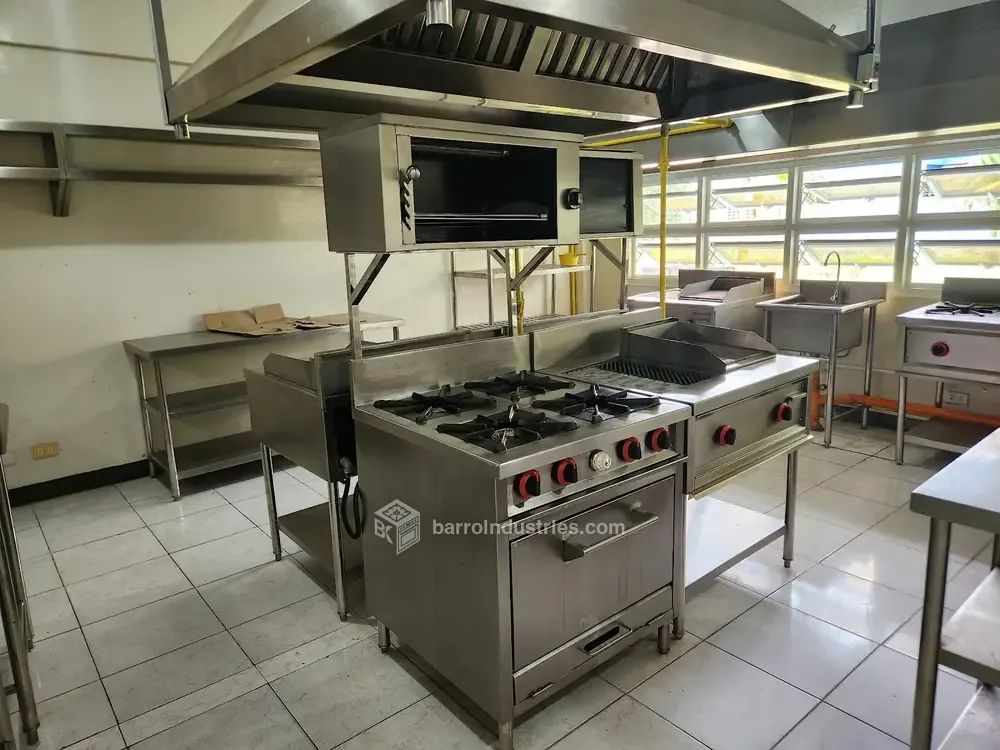 DMMMSU — finished commercial kitchen with range, hood and work tables