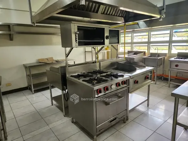 DMMMSU — finished commercial kitchen with range, hood and work tables