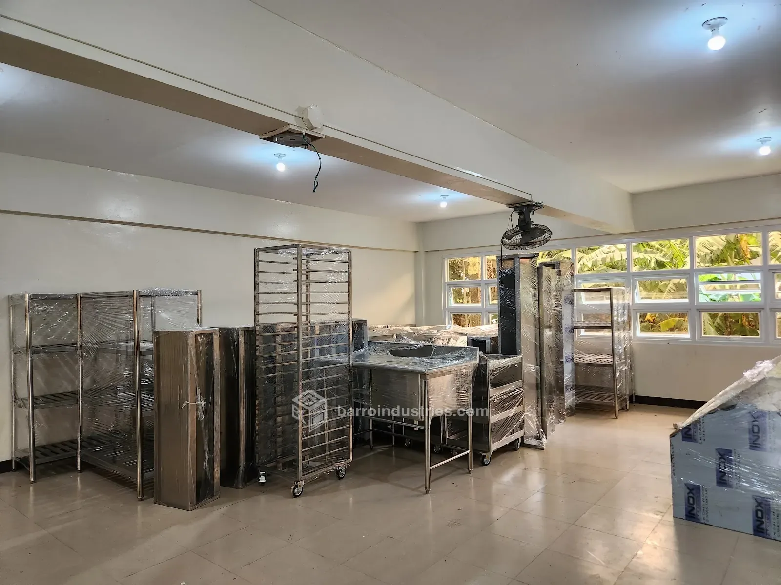 Stainless-steel tables, racks and shelving installed on a university campus