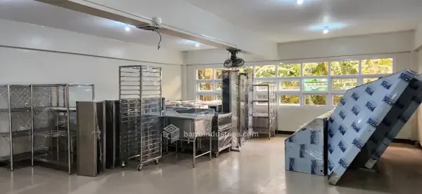 DMMMSU — stainless-steel shelving and work tables after installation