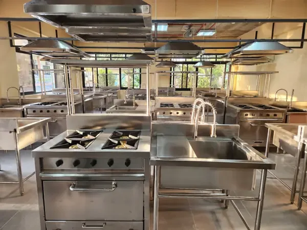 ISPSC 2026 — wide view of the cooking stations with range ovens, sinks and overhead hoods